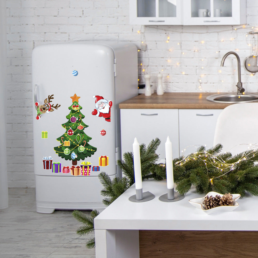 White refrigerator with a Christmas tree decal in a kitchen