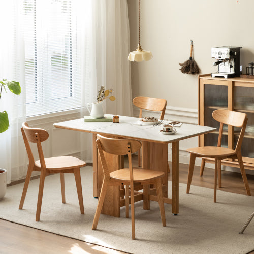 Modern oak wood dining chairs set in a dining room