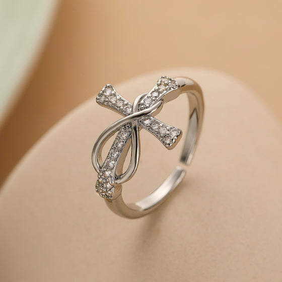Close-up of the adjustable silver-tone bow ring