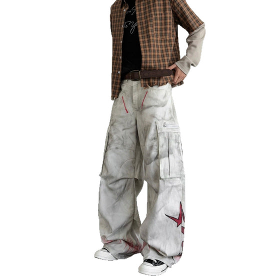 Model in baggy washed white cargo jeans with a red star