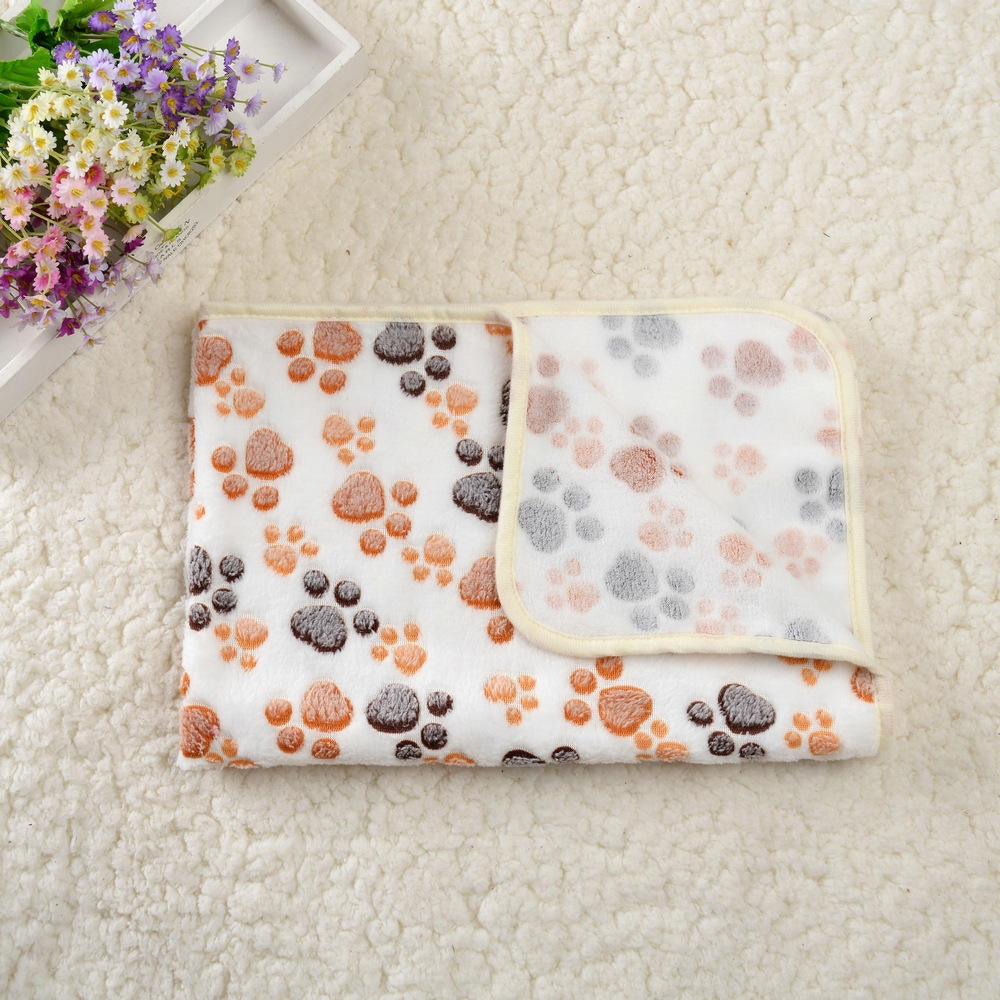 Cream and tan paw print pet blanket folded