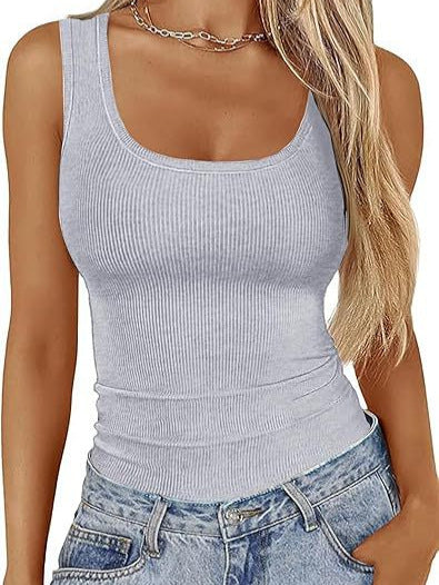 Woman in a gray ribbed tank top and jeans