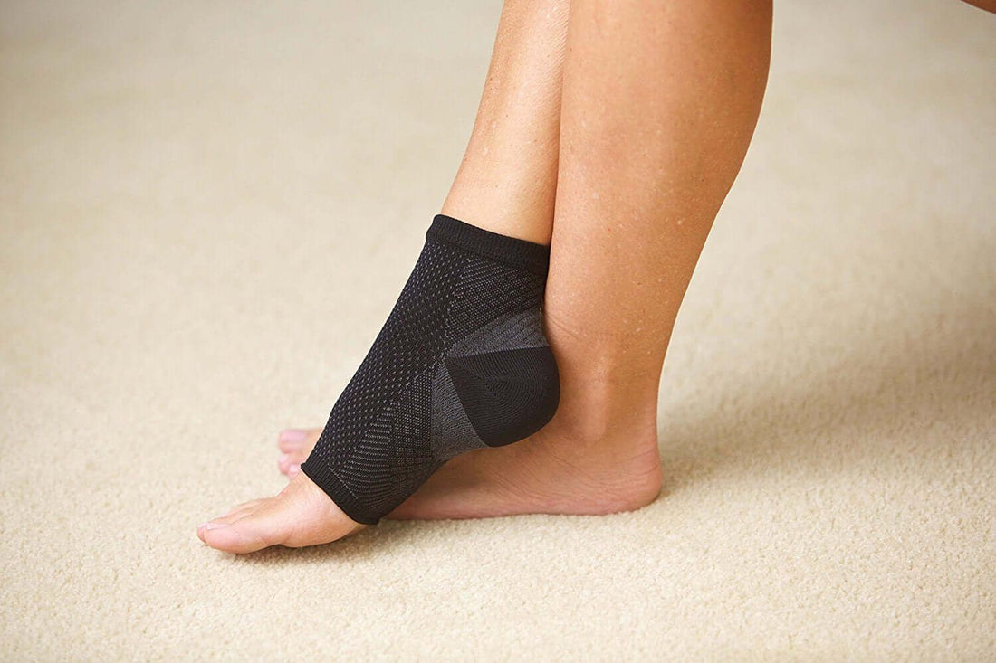 compression ankle socks on foot for plantar fasciitis support