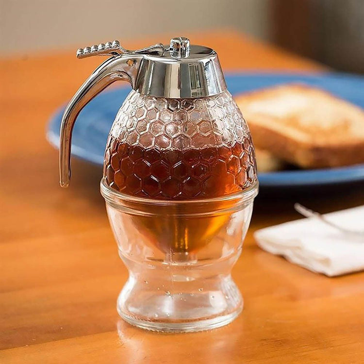 Honey and syrup dispenser with press-handle pour