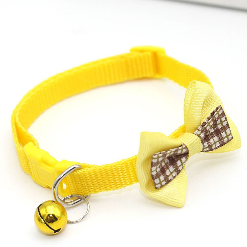 Cat collar bell close-up on nylon bow tie strap