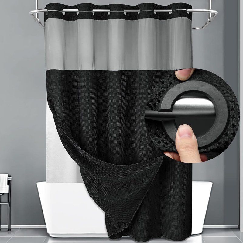 Black waffle weave shower curtain hung on rod