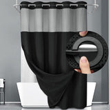 Black waffle weave shower curtain hung on rod