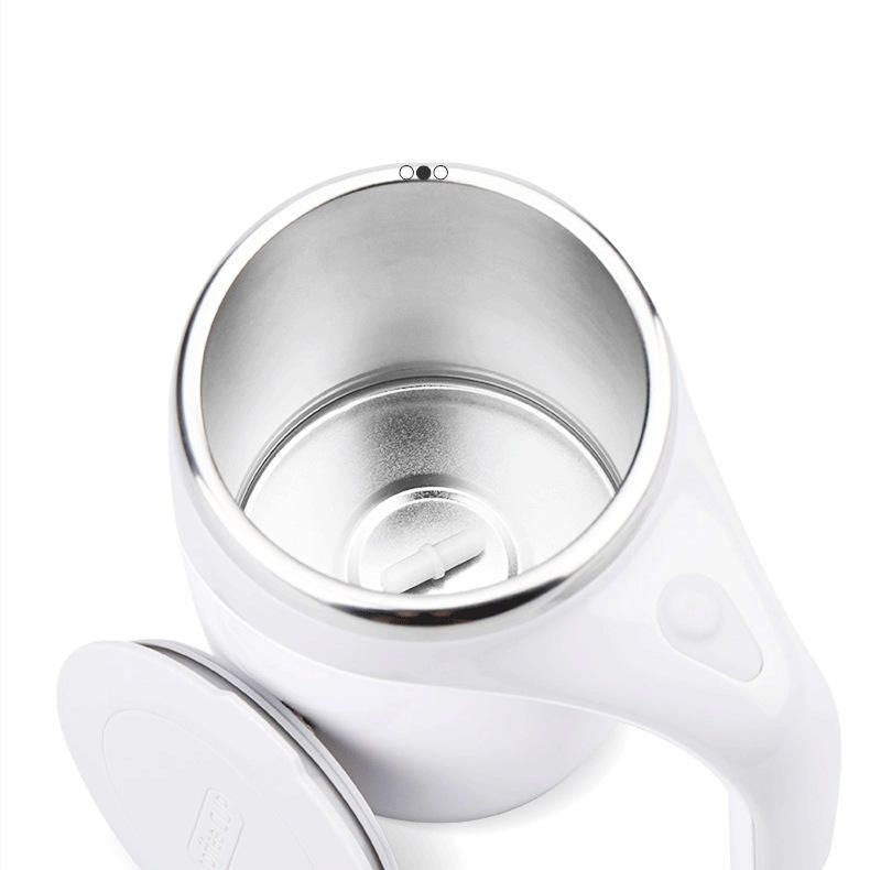 Self stirring coffee mug mixing creamer in motion