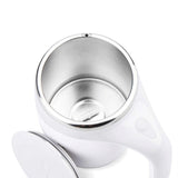 Self stirring coffee mug mixing creamer in motion