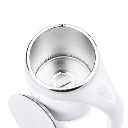 Self stirring coffee mug mixing creamer in motion