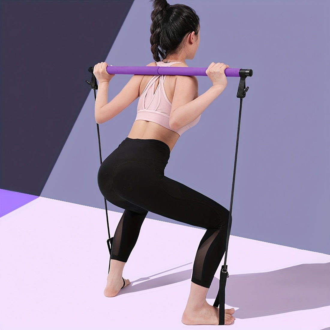 Pilates bar with resistance bands in purple