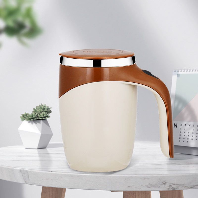 White self stirring tea mug on desk