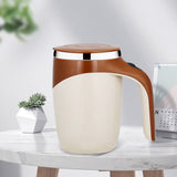 White self stirring tea mug on desk