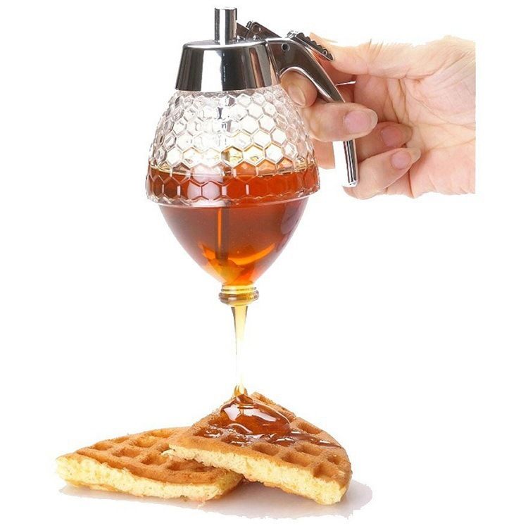 Transparent honey dispenser body showing fill level