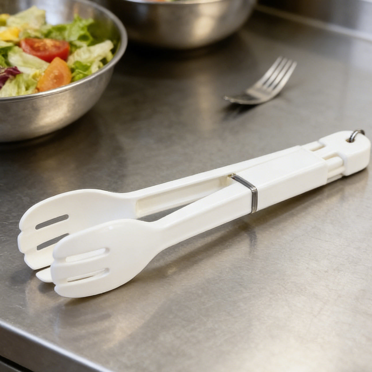 Stainless steel tongs ergonomic grip close-up