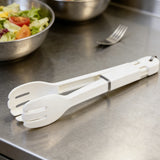 Stainless steel tongs ergonomic grip close-up