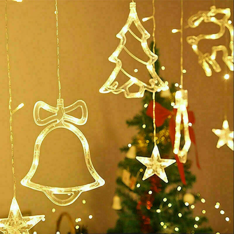 Warm white LED Christmas tree and bell shapes on the curtain lights