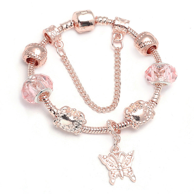 Rose gold-tone charm bracelet with butterfly pendant and pink beads