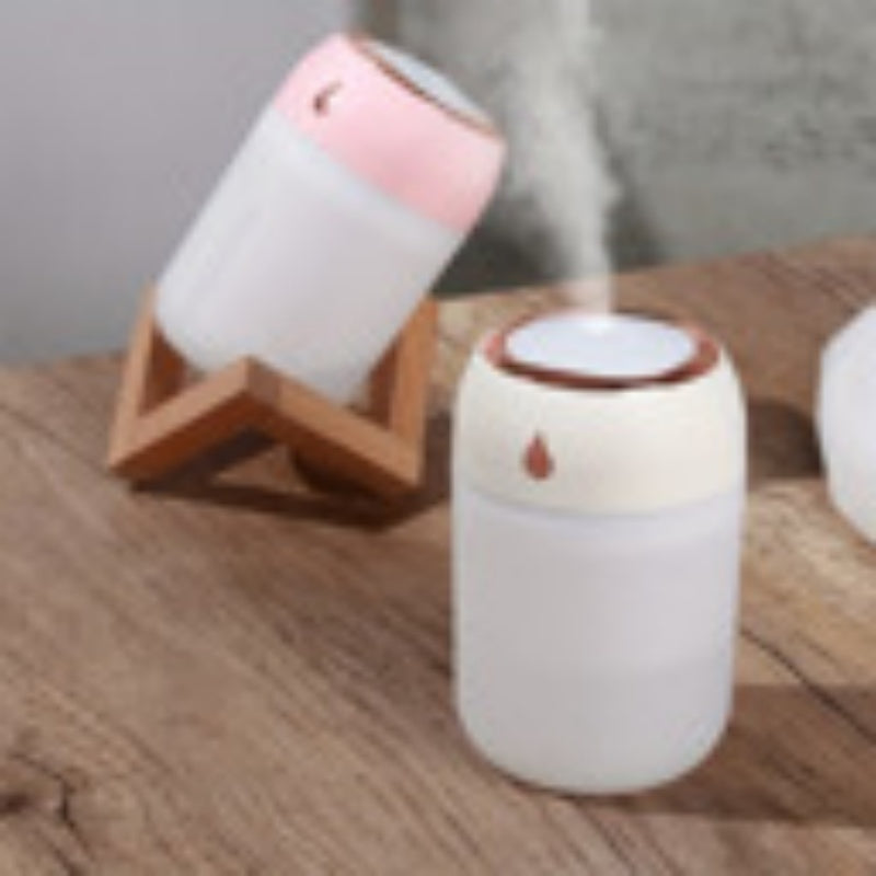 Portable mini USB cool mist humidifier on desk