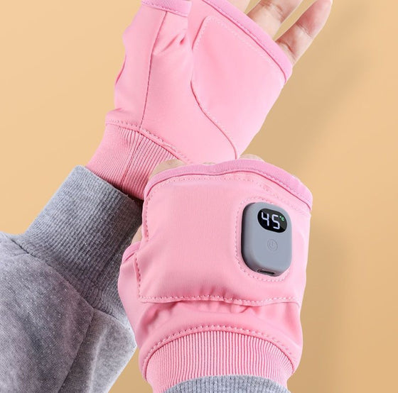 Pink heated glove worn on the wrist showing the digital display button
