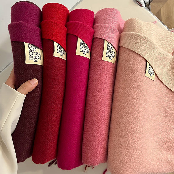 Stack of red, burgundy and pink double-sided scarves