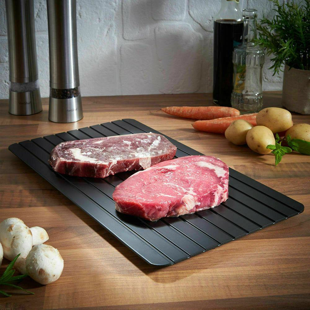 Defrost tray thawing frozen steak
