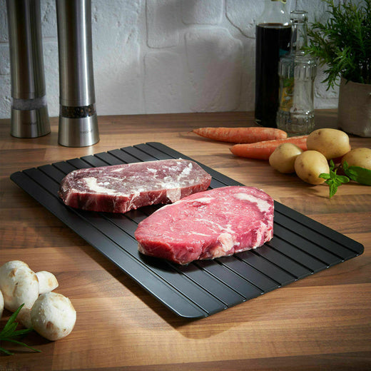 Defrost tray thawing frozen steak