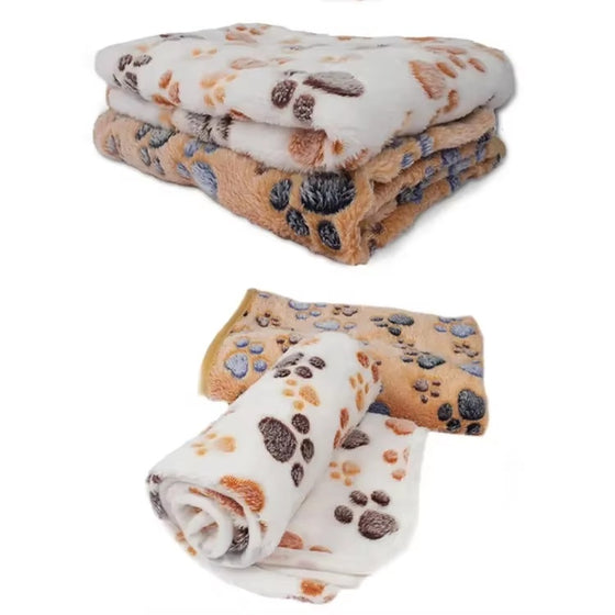 Folded paw print pet blankets stacked