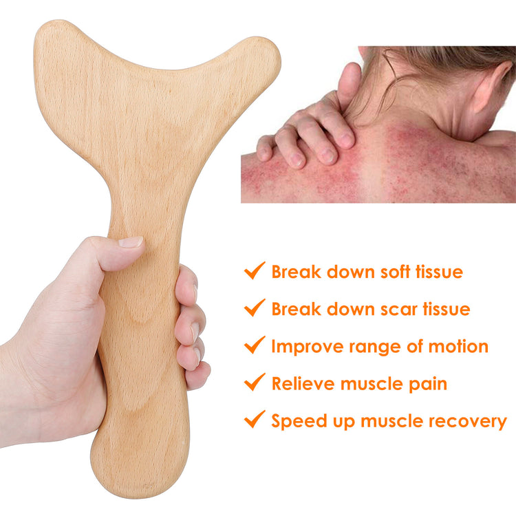 Wood therapy tool with body oil on a towel