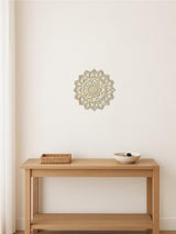 Metal mandala wall art in a meditation corner setting