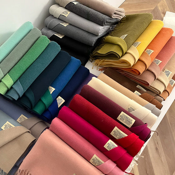 Stack of double-sided scarves in many colors