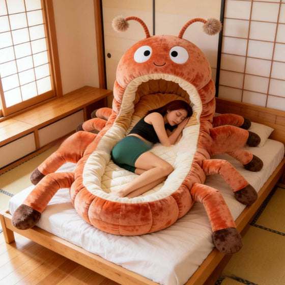 Woman lying inside an orange plush creature sleeping bag on a bed