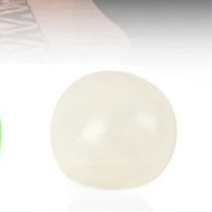 Glow-in-the-dark sticky squeeze balls stuck to a ceiling, photo 6