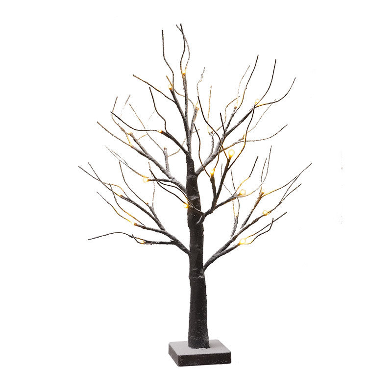 Snow-dusted LED birch tree with bare branches on a white background
