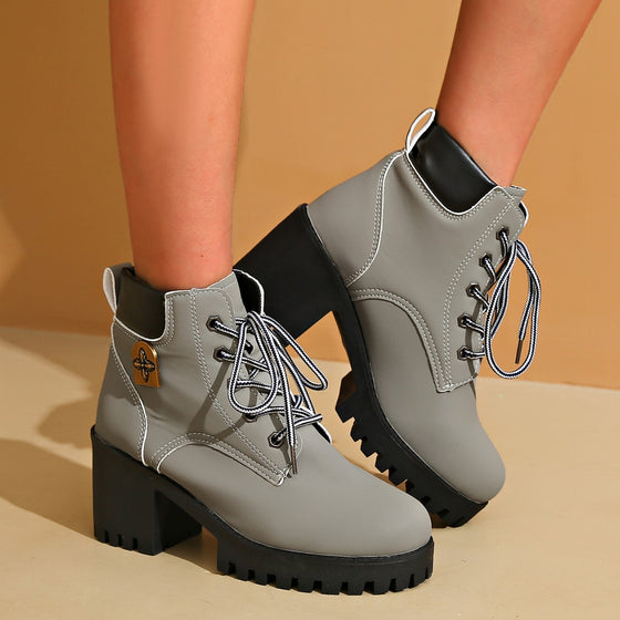 Gray lace-up chunky heel boot with a brown side tab