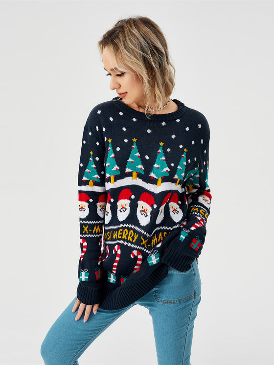 Three-quarter view of a woman in a navy Christmas pullover