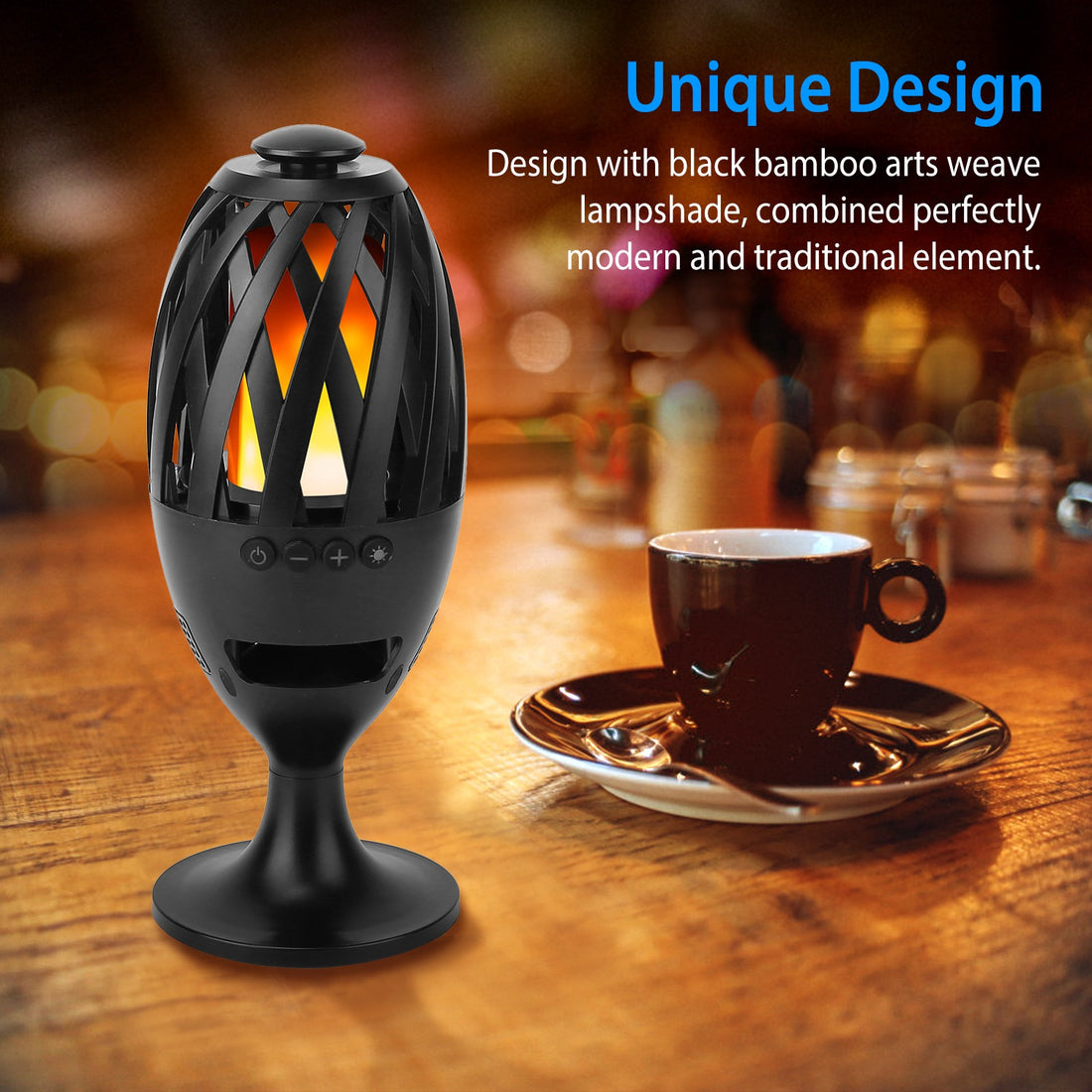Flame speaker on a table next to a coffee cup