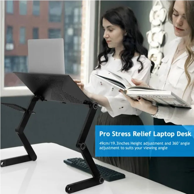 Foldable laptop desk on bed with laptop, front view