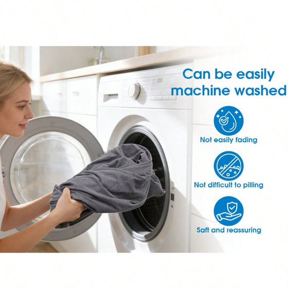 Gray sleep pod blanket being placed into a washing machine