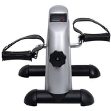 Pedal bike trainer positioned under a desk while working