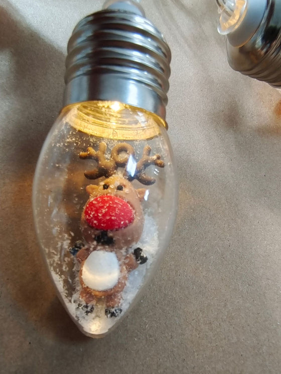 Clear bulb string light with a miniature reindeer figure inside, Little Dear option