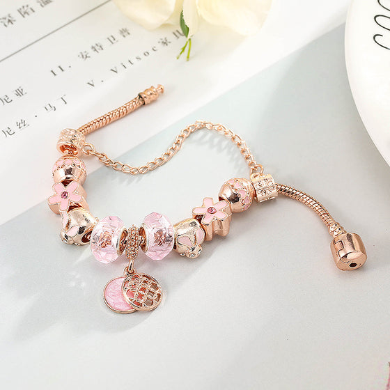 Charm bracelet with a round pendant, style for reference