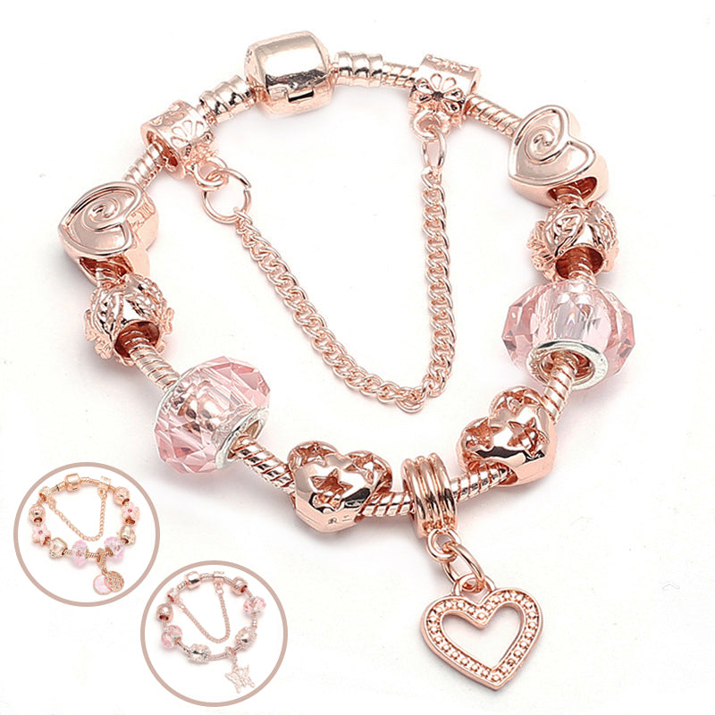 Rose gold-tone charm bracelet with a heart pendant, style for reference
