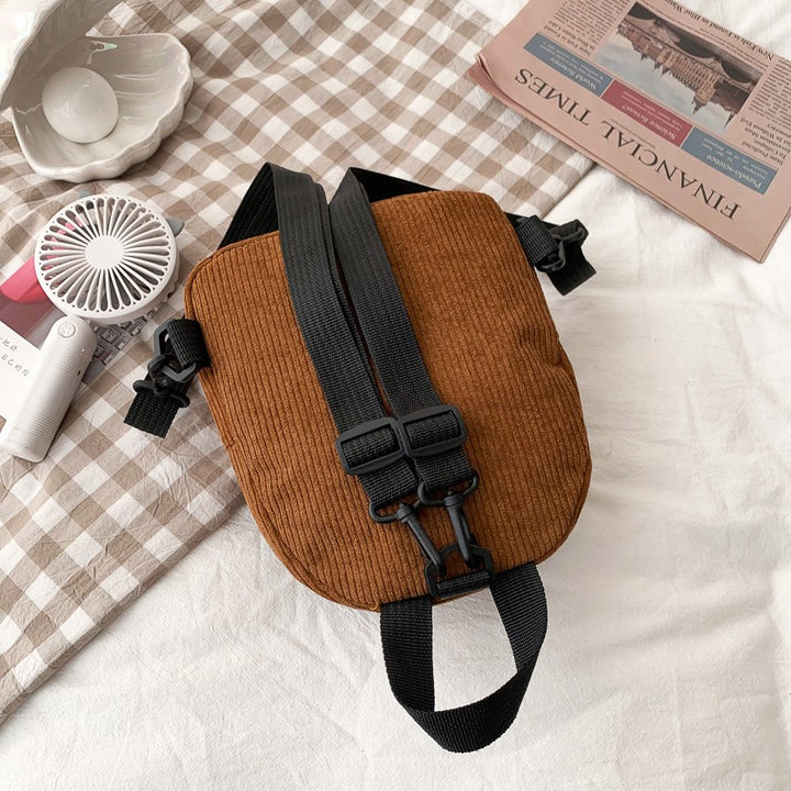 Women's corduroy mini backpack, zipper closure detail