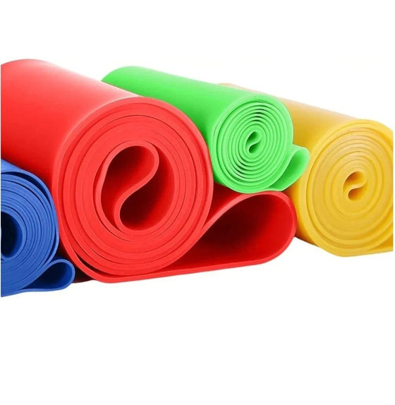 Close-up of rolled green, red, yellow and blue resistance bands