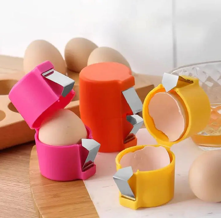 Peeled hard-boiled egg halves next to the opened shell tool