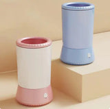 Pet foot washing cup with a dog's paw being dipped inside