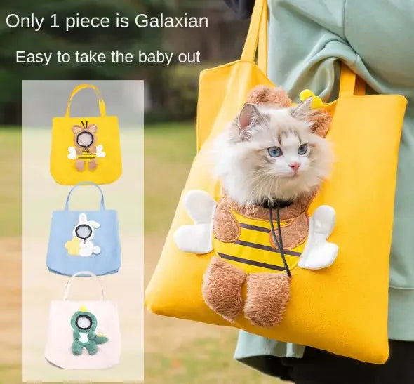 Handbag-style pet carrier with a round window opening for the pet's head and a plush character applique on the front