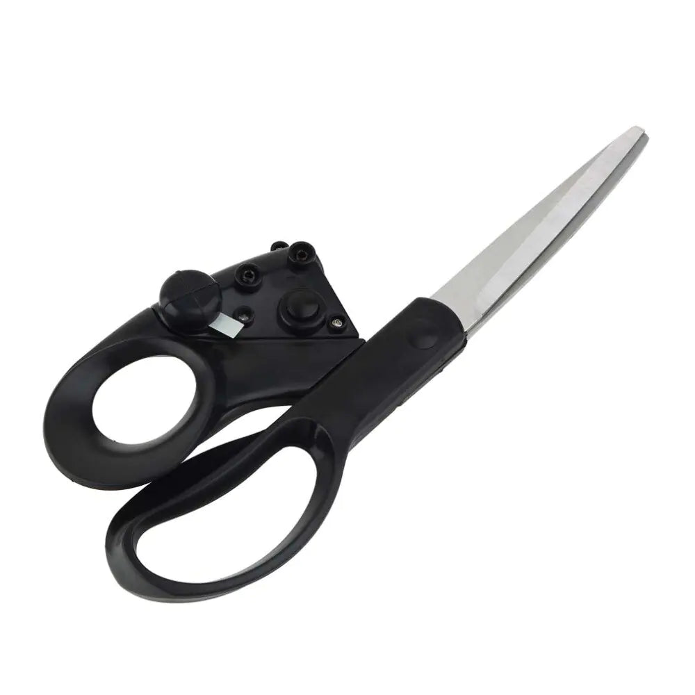 Scissors cutting fabric along a marked pattern line