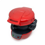 Electric breakfast sandwich maker closed, showing preheat and power indicator lights